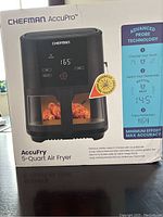 Front of the boxed Chefman 5-Quart AccuPro Air Fryer showing branding, features, and image of the appliance.