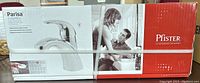 Box front showing Pfister Parisa bathroom faucet with image of the faucet and family photo on the packaging.