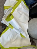 Deflated PVC panels white with lime green edging laid out on floor