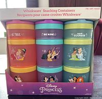 Photo of the Whiskware Disney Princess snacking containers set in original box with three containers visible.