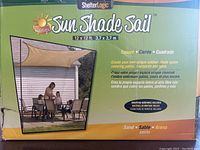 Photo of the ShelterLogic Sun Shade Sail box with key product information and color.