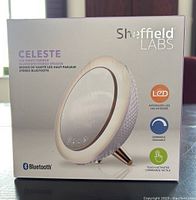 Box front of the Sheffield Labs Celeste LED vanity mirror with Bluetooth speaker featuring product image and features.
