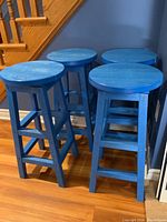 All four stools grouped together in corner