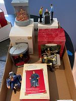 Box containing five Hallmark Star Trek Keepsake ornaments, some boxed and some unboxed.