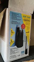Photo of the original box showing Bur-Cam submersible pump features and specifications.