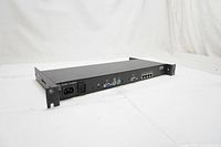 Rear and side views of IBM NetBay Local Console Manager rackmount device showing power inlet, VGA, PS/2 ports, serial port, 4 RJ-45 Ethernet ports, and mounting brackets.