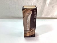 Front view of the Laura Mercier tinted moisturizer box showing the brand, product name, and volume (30ml).