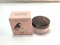 Box and container of Laura Mercier Translucent Loose Setting Powder Glow, showing product and packaging condition