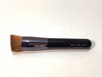 Top view of the Shiseido Perfect Foundation Brush clearly showing the brush head and handle with branding.