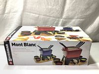 Photo of the Swissmar Mont Blanc fondue set retail box showing product images and branding.