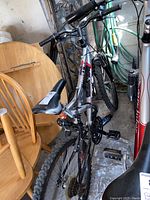 Overview of the Supercycle Thrill bicycle showing frame, seat, and pedals.