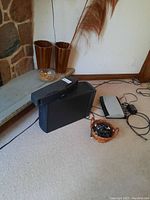 Overview showing bass module, VCS-10 center speaker, AV28 control unit and cable basket on carpet