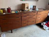 Front view of dresser in room showing all twelve drawers and overall condition