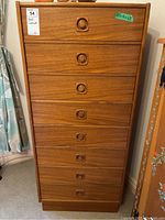 Front view of full-height cabinet showing eight drawers and overall design