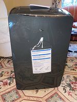 Front view of the LG portable air conditioner unit showing brand logo and front panel