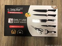 Front of box showing brand, 6 pcs Daily Use Sharp Knives with embossed blade.