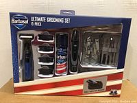 Front of packaged Barbasol 15 piece grooming set showing all contents.