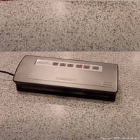 Front angle view of vacuum sealer showing control panel and design.