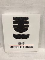 Front of box showing EMS muscle toner design representing abdominal and arm pads