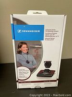 Front view of Sennheiser SET 830 S-MKE retail box showing product image, usage example and branding