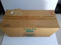 Closed cardboard box with Parkhurst 24533 NHL Parkhurst 2 master shipper label, showing the lot contains half cases of hockey card boxes.