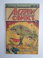 Front cover of 1976 reprint Action Comics #1 showing Superman lifting a green car with original 1938 design and 10 cent cover price