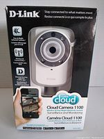 Front of D-Link DCS-932L camera box showing camera image and key features like day & night infrared camera, wireless N connectivity, and remote viewing.