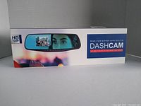 Front view of the product box showing image of the rear view mirror with built-in dashcam and branding details: HD 720p resolution, Pilot brand.