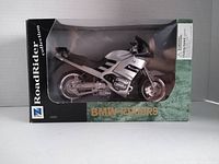 Front view of the boxed die-cast BMW R1100RS motorcycle model showing the RoadRider Collection branding and clear display window.