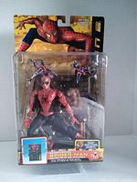 Front view of factory sealed Spider-Man 2 Spider Sense action figure in blister packaging showing the figure, tentacle base, and accessory figures.