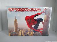 Front of the sealed Spider-Man limited edition collector's DVD gift set box showing Spider-Man swinging over New York City.