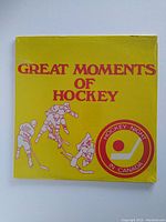 Front cover of the sealed LP album showing title 'Great Moments of Hockey' with hockey players and HNIC logo.