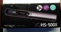 Photo of the front side of the VistaQuest VQHS-500X handheld portable scanner box, showing the product image and branding.