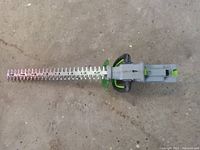 Top view of hedge trimmer showing dual-action blades and main body