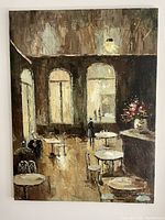 Full view image of the original unframed oil painting depicting the interior of a cafe with tables, chairs and a vase with flowers on the counter.