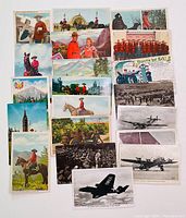 Photo showing a spread of assorted antique postcards with Mounties in red uniforms, Ontario landscapes, and vintage airplanes.