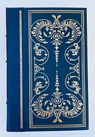 Front cover of the Tom Jones book showing detailed gold embossed decoration on dark blue leather cover