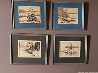 Set of 4 framed ink on paper drawings by Pauline Kulha, mounted on wall showing varied blue and black mats.