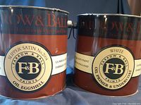 Two gallon cans of Farrow & Ball paint products side by side showing labels: Oil Primer & Undercoat in White and Oil Eggshell paint in Slipper Satin No. 2004.