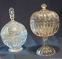 Two clear lead crystal lidded dishes described from the seller, showing different shapes and intricate cut patterns.
