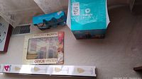 Wide view showing boxed champagne flutes, kitchen board, and Magic Bullet blender box.