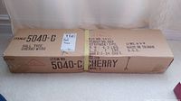 Front view of sealed rectangular cardboard box marked with item number 5040-C, hall tree in cherry wood, weight and dimensions, and origin Taiwan R.O.C.