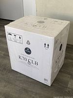 Photo of sealed original box packaging for Keurig K70 CLB Platinum Single Serve Coffee Maker, wrapped in clear plastic with product labels visible.