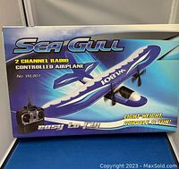 Photo of boxed Sea Gull 2-channel radio controlled airplane WL801 with artwork of the airplane and remote controller on front of box.