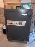 Front view of large dark gray Summit Safe by Kumahira with combination lock and handle.