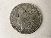 Obverse side of the 1899 O Morgan Silver Dollar showing Lady Liberty profile, date 1899 and inscriptions E PLURIBUS UNUM.