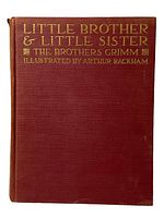 Front cover of the book showing deep red cloth with gold embossed title and illustrator's name.