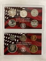 Front view of the two protective cases showing the five silver state quarters and silver dime, half dollar, with a penny and Kennedy half dollar.