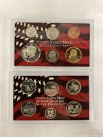 Front and back of main 2004 US Mint Silver Proof Set with dime, half dollar, pennies, and quarters in plastic case on American flag background.