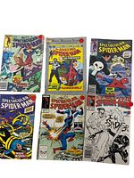 Photo showing six Spider-Man comics including The Spectacular Spider-Man, The Amazing Spider-Man with The Punisher, and Peter Parker Spider-Man issues sealed in plastic bags.